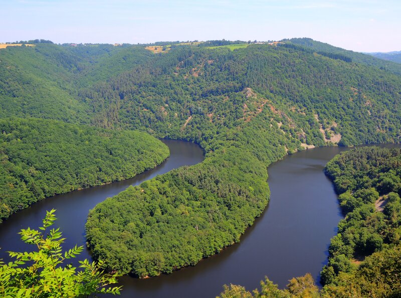 river winding through forested hills