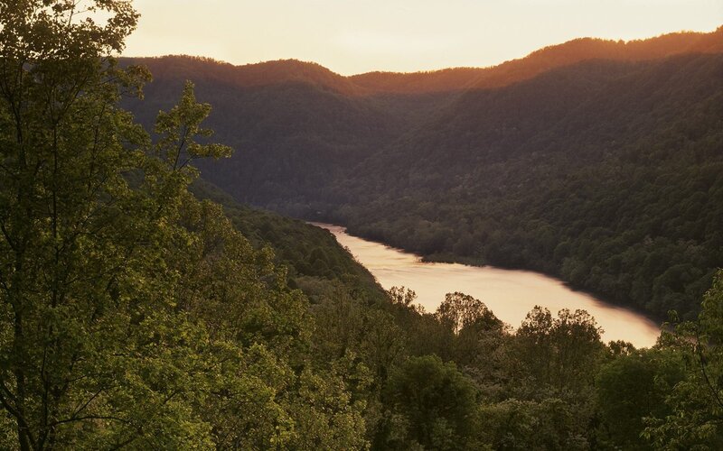 river winding through forested valley