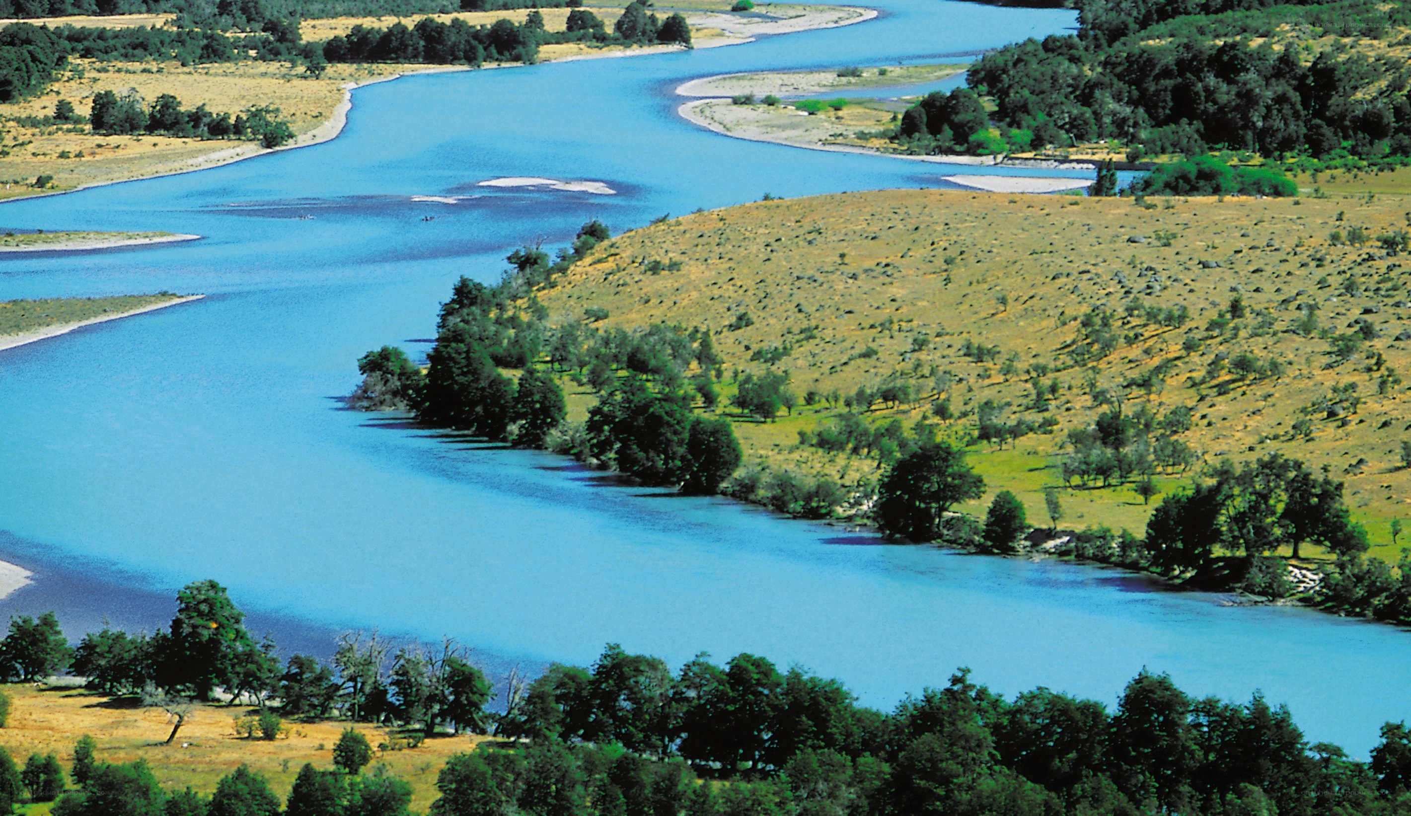 River winding through grassy landscape