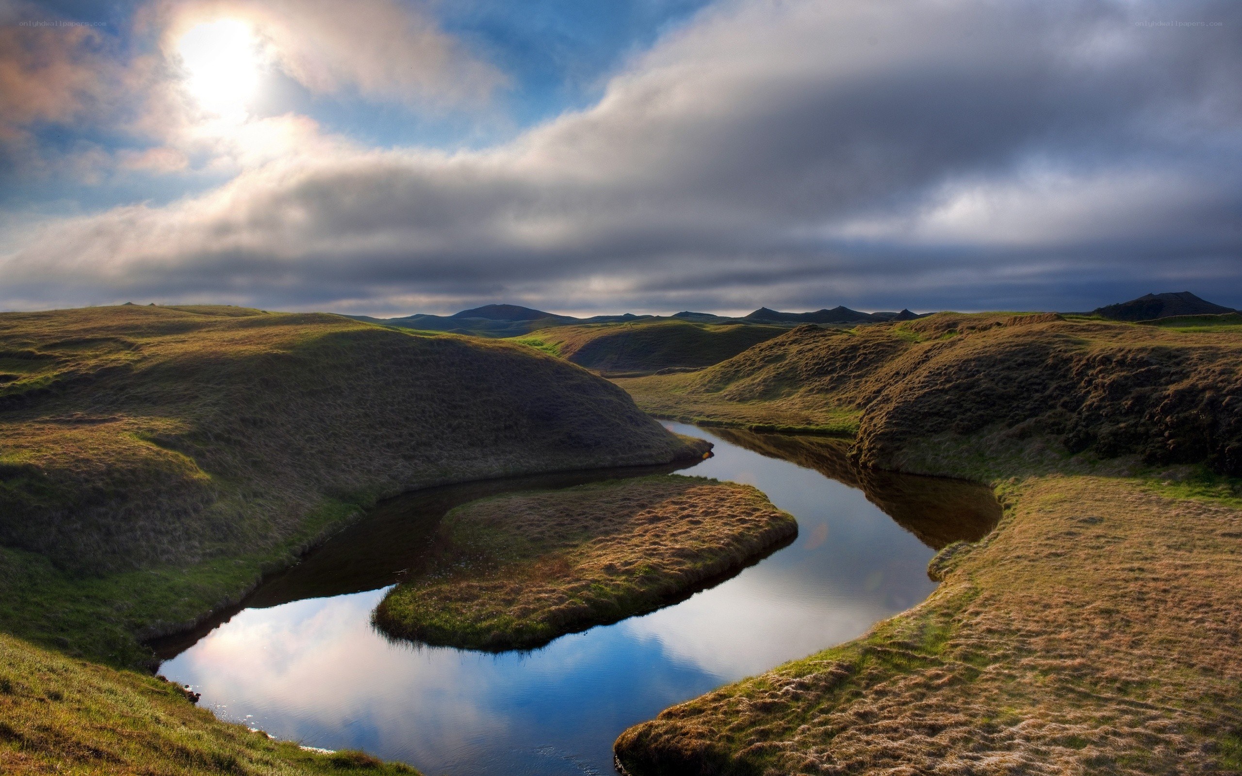 River winding through green hills