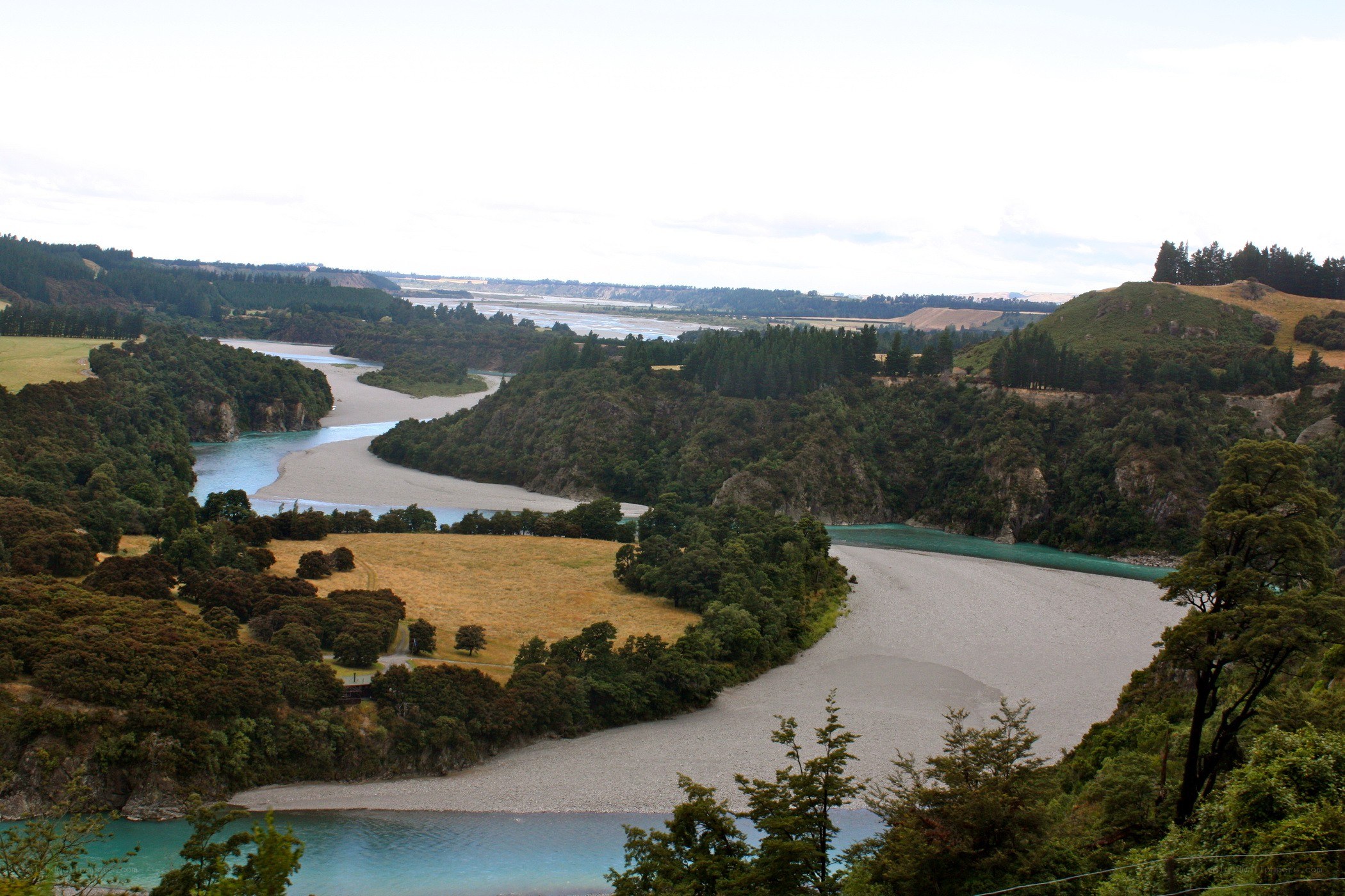 river winding through green hills