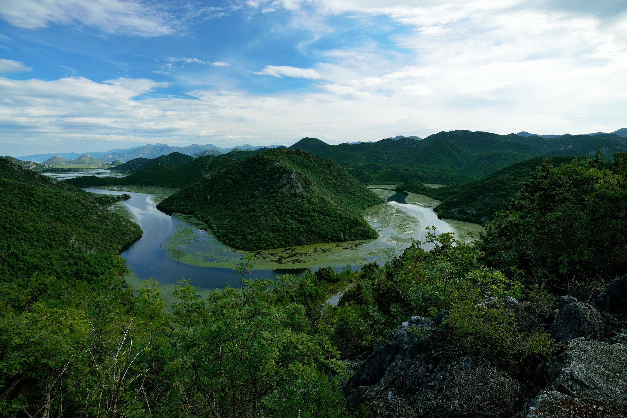 River winding through green hills
