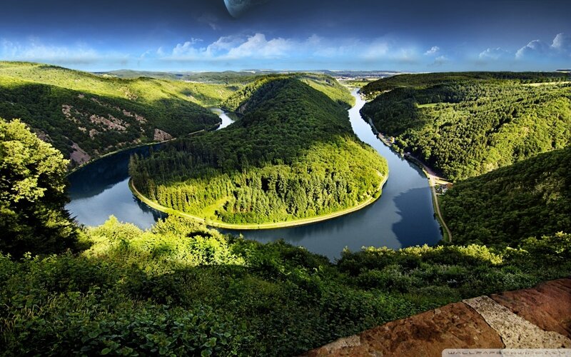 river winding through green hills
