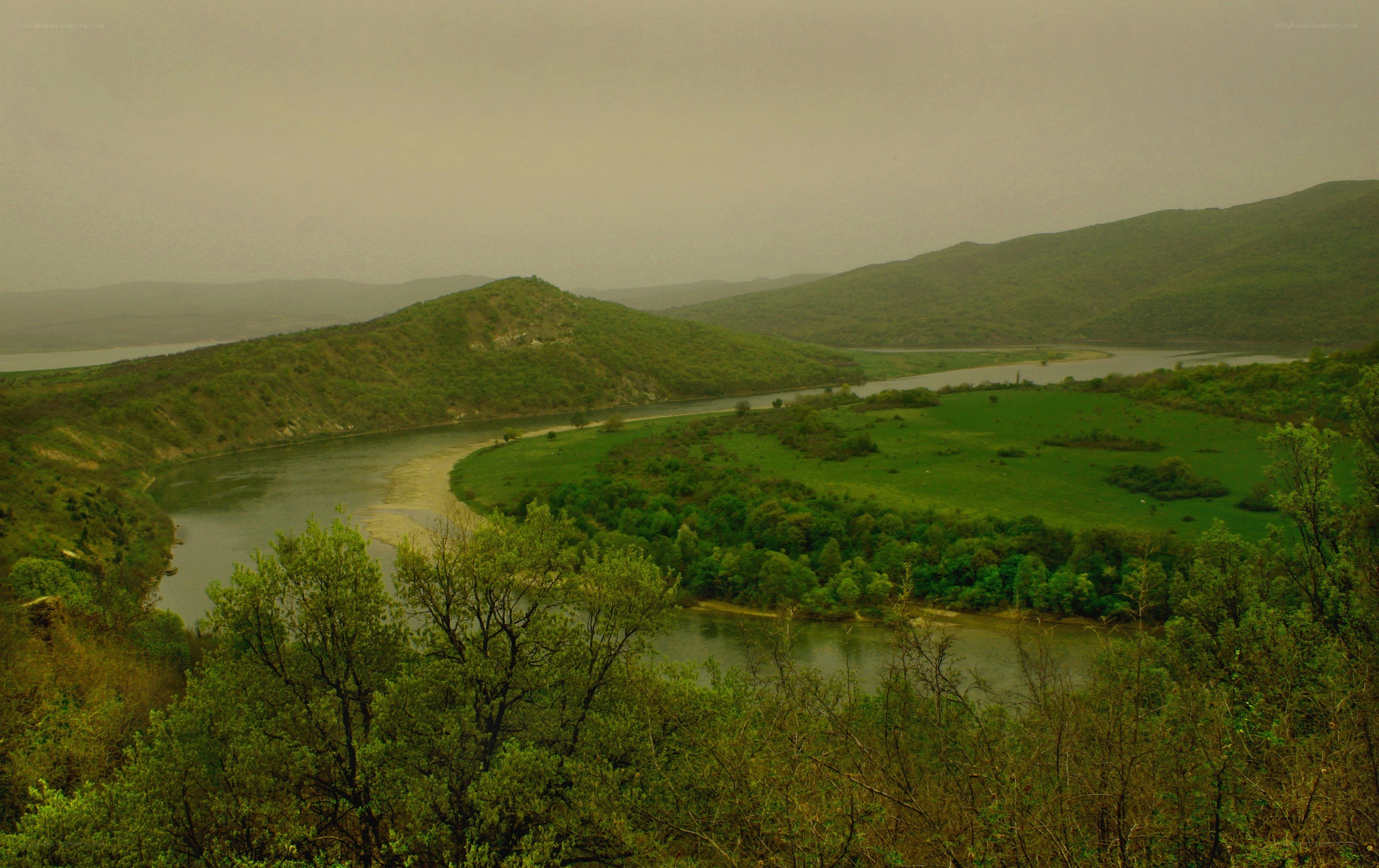 River winding through green hills