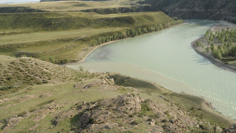 river winding through green hills