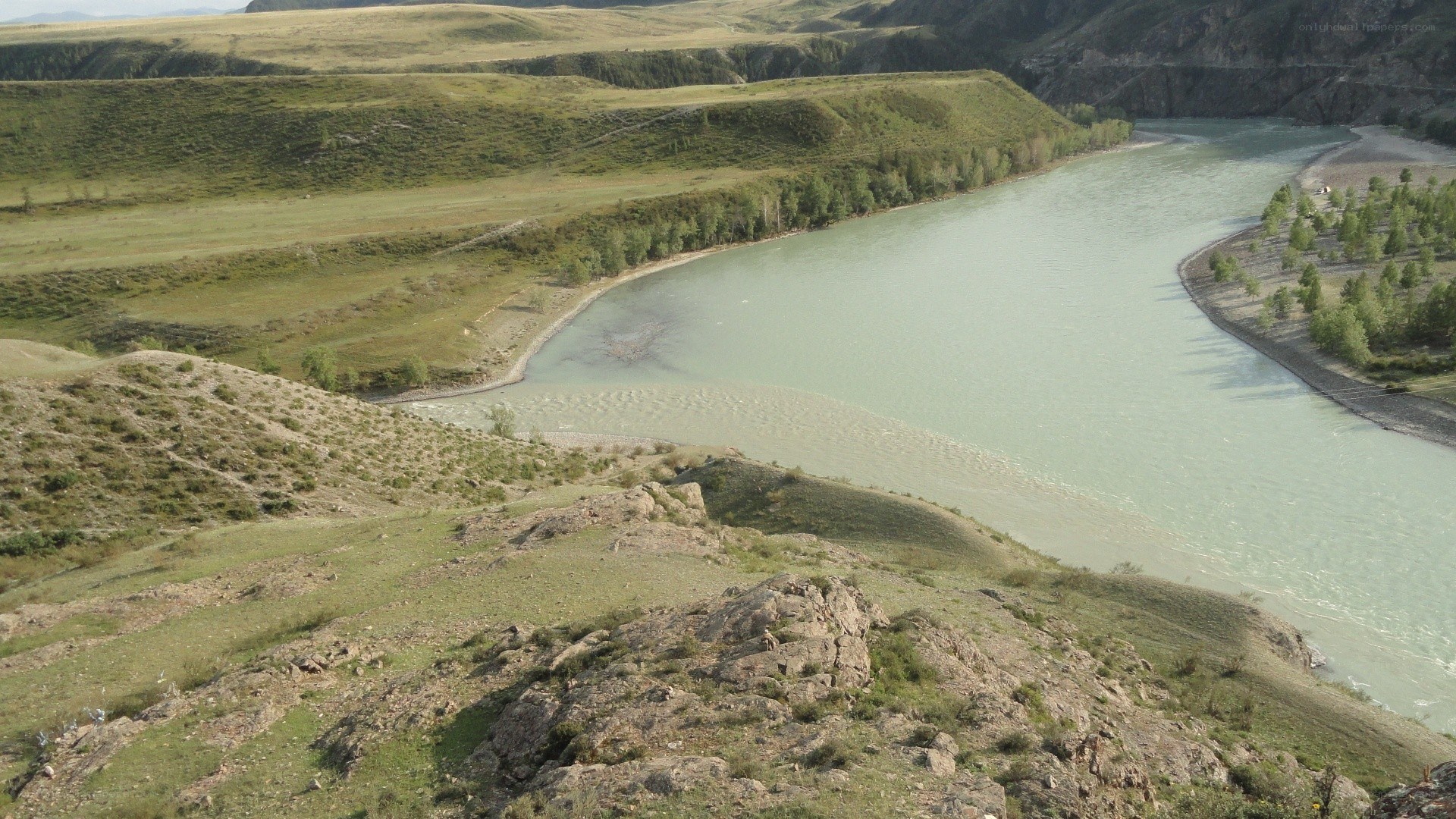 river winding through green hills