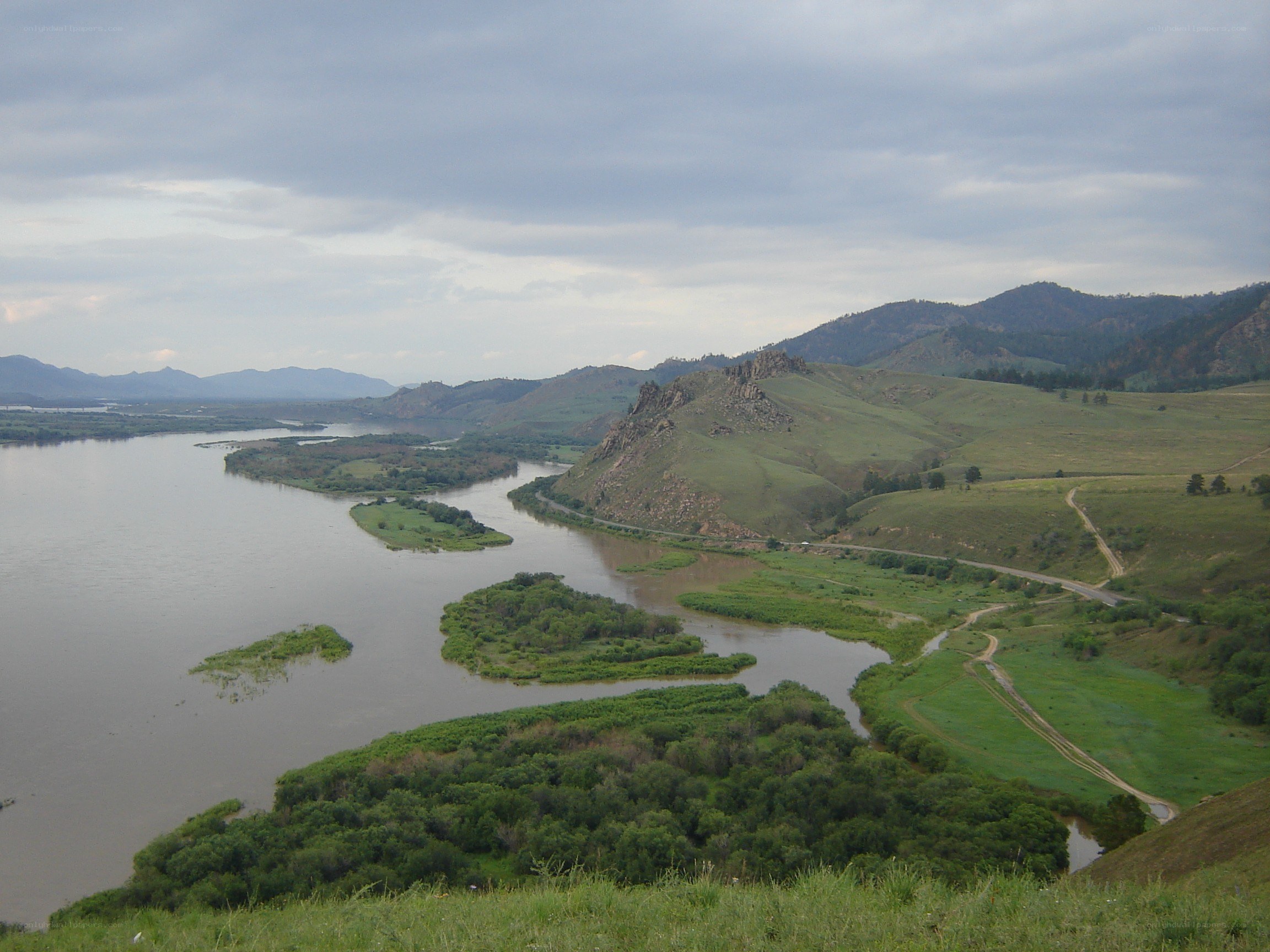 river winding through green hills