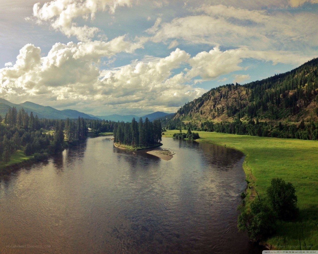 river winding through green valley