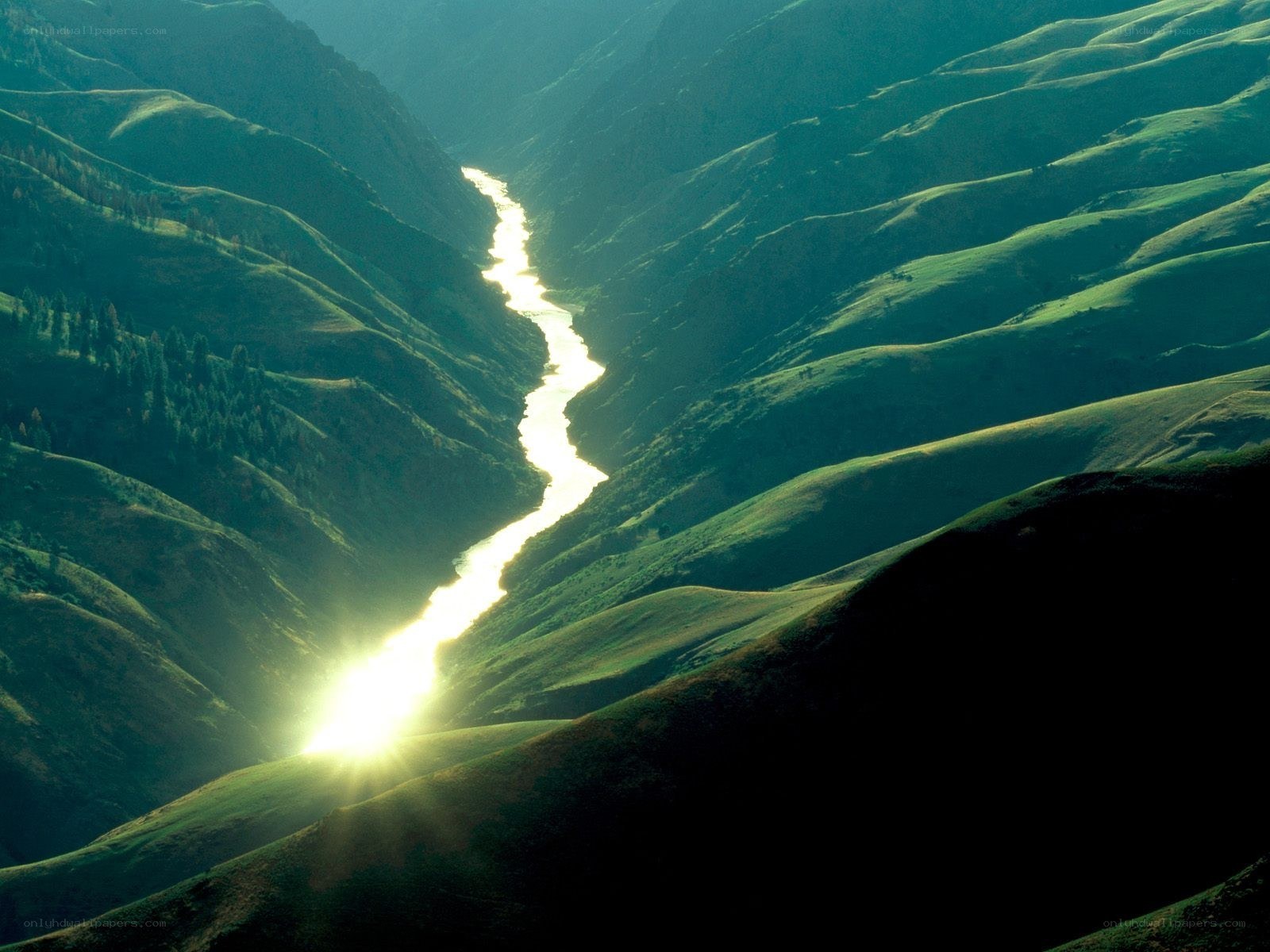 River winding through green valley