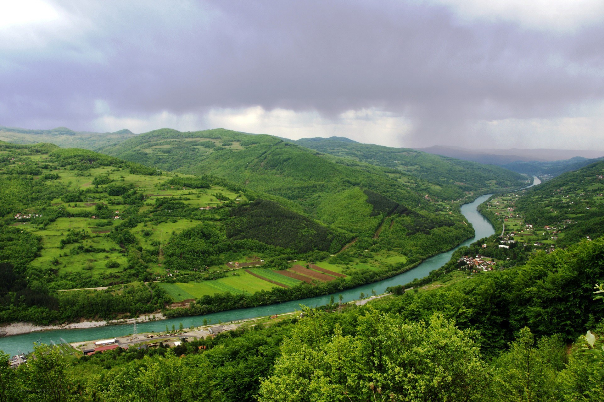 River winding through green valley