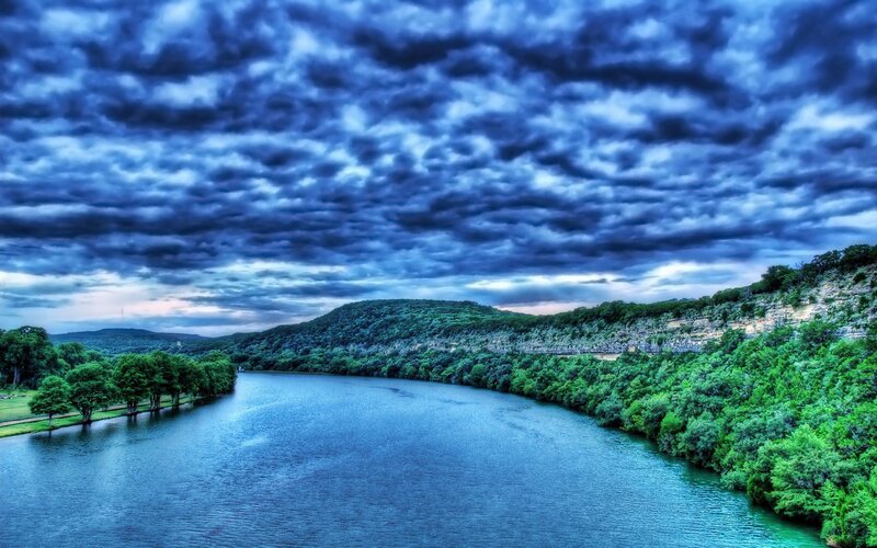 River Winding Through Hills — Blue, Dramatic, Sunset, Photograph, Clouds, Trees, Green