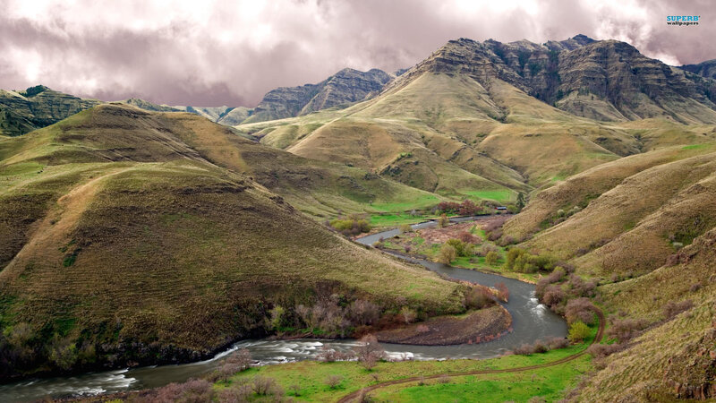 River Winding Through Hills — Green