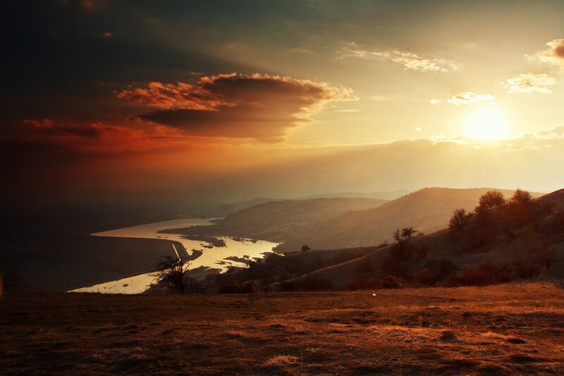 River Winding Through Hills — Orange