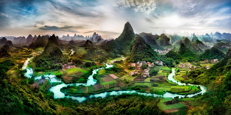River Winding Through Karst Mountains — Green, Dramatic, Sunset