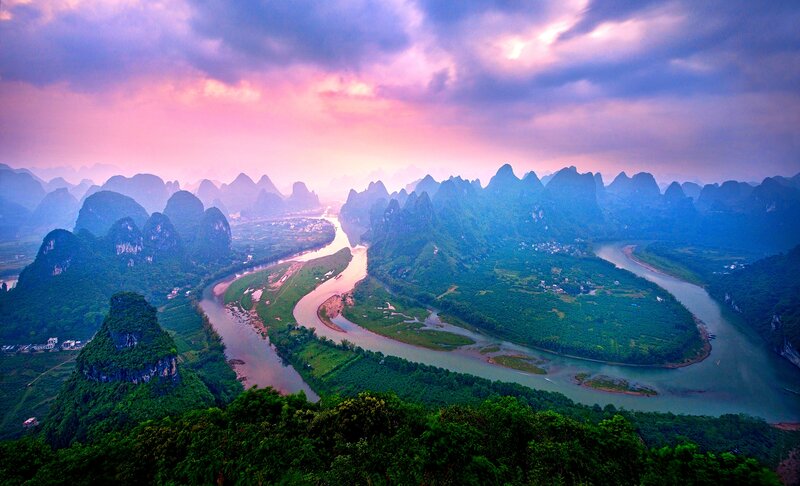 River Winding Through Karst Mountains — Green, Dramatic