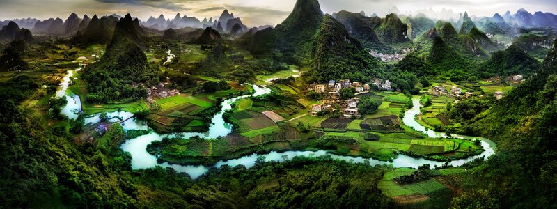 River Winding Through Karst Mountains — Green, Serene