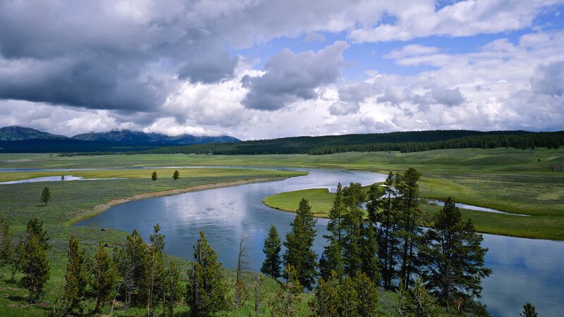 River Winding Through Meadow — Green, Dramatic