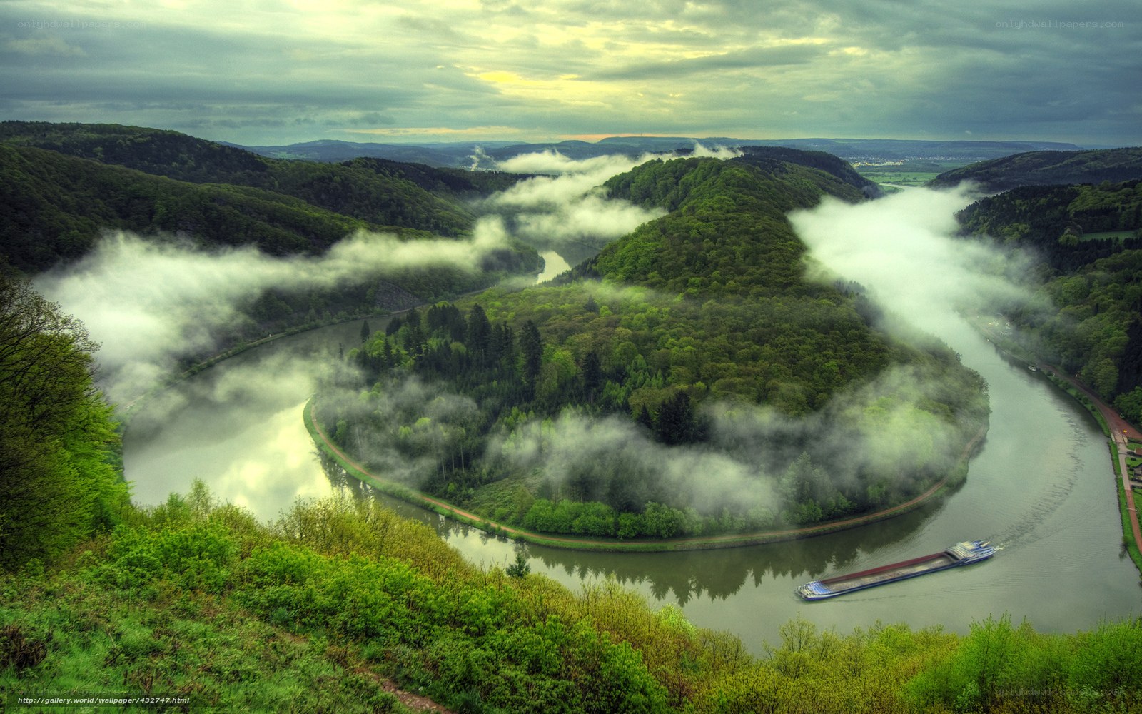 River winding through misty valley