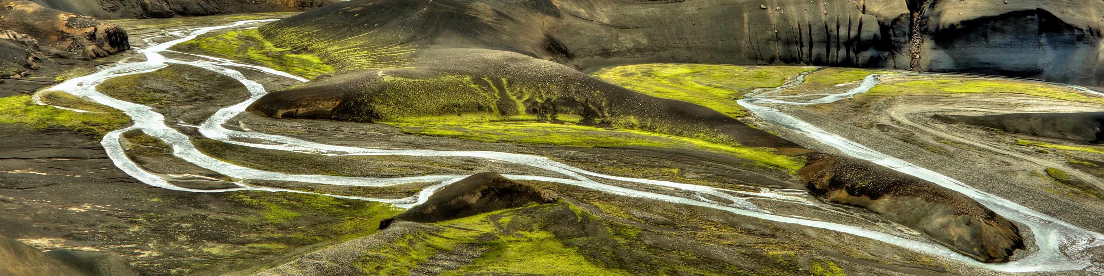River winding through mossy landscape