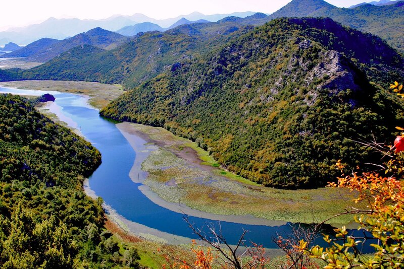 River Winding Through Mountains — Green, Serene, Autumn