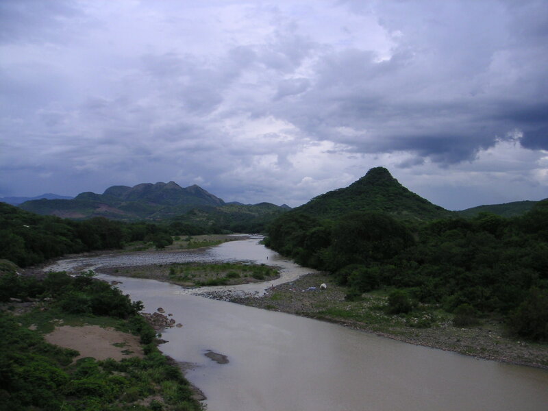 River Winding Through Mountains — Green