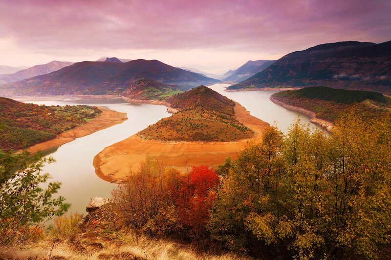 River Winding Through Mountains — Purple