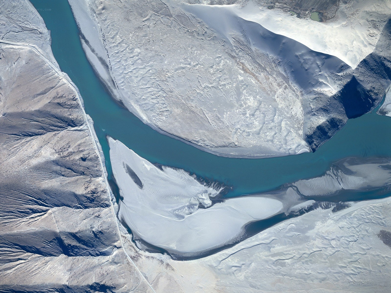 river winding through snowy landscape
