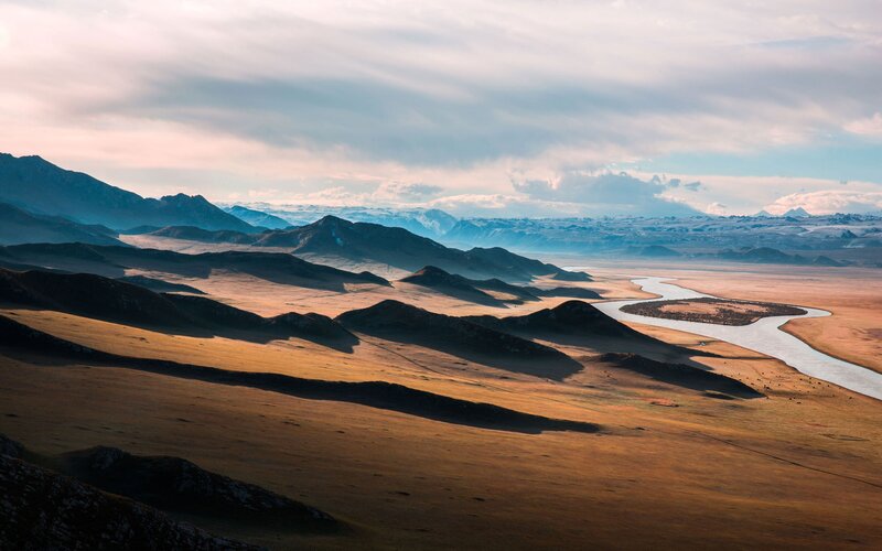 River Winding Through Valley — Brown, Serene