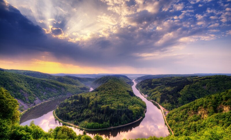 River Winding Through Valley — Green, Dramatic, Sunset, Photograph, Clouds, Hills