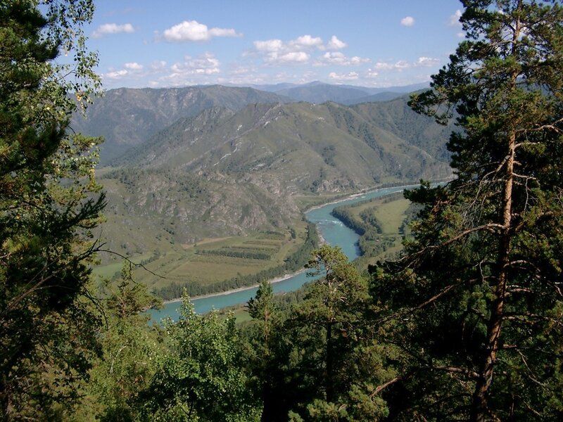 River Winding Through Valley — Green, Serene, Afternoon, Photograph, Mountains, Trees, Sky