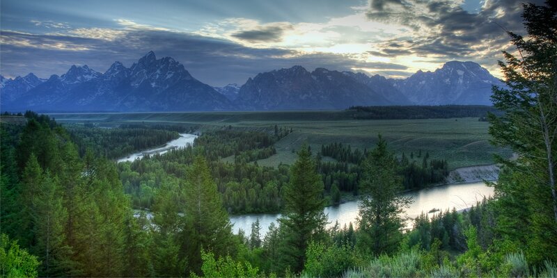 River Winding Through Valley — Green, Serene, Sunset, Photograph, Mountains