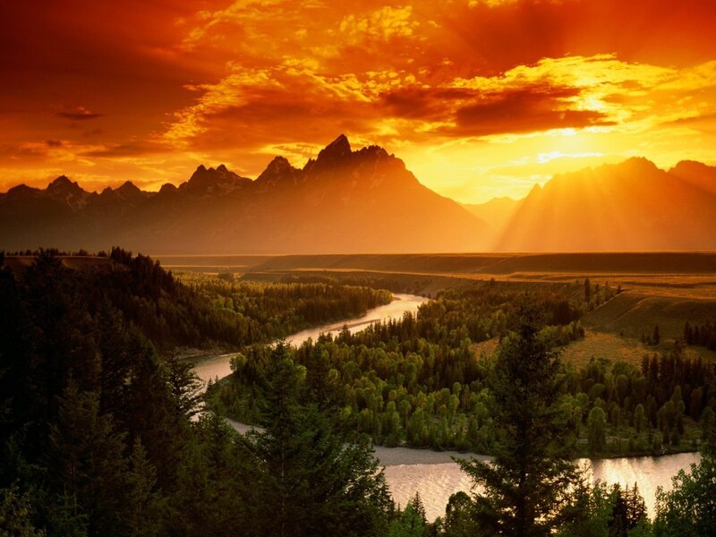 River Winding Through Valley — Sunset