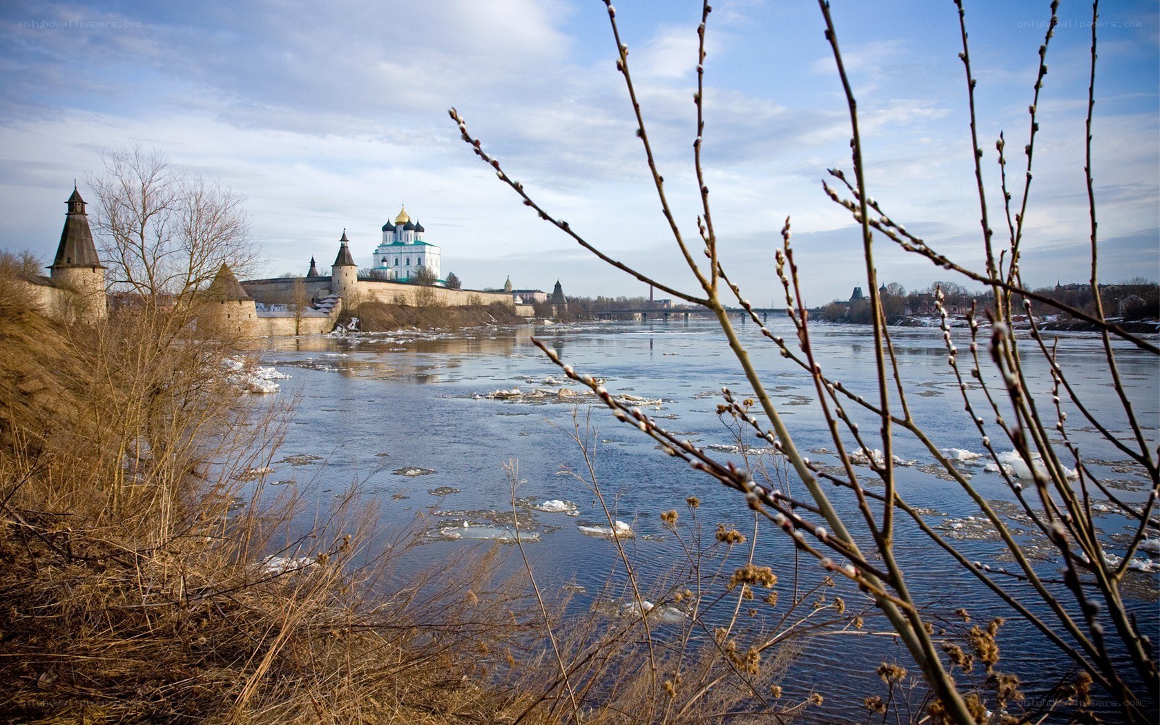 River with ancient fortress in background