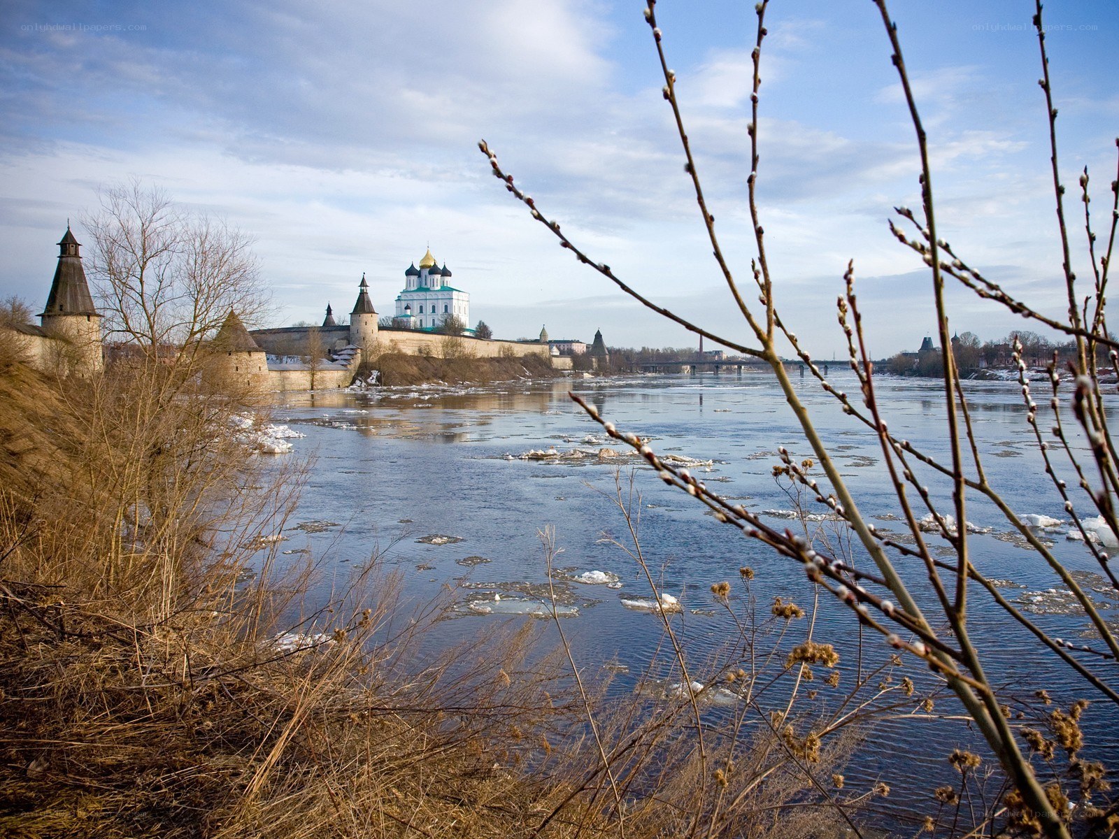 River with ancient fortress in background