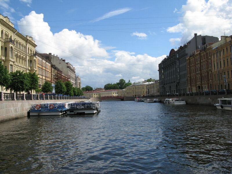 River with Boats and Buildings — Blue