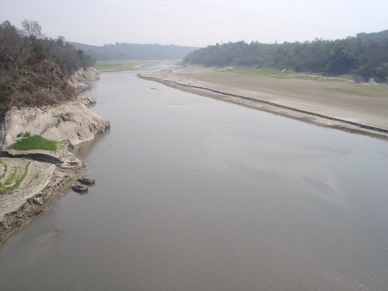 River with boats and exposed banks
