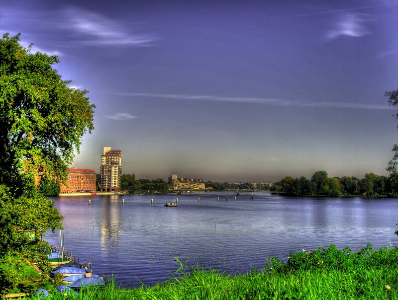 River with Bridge and Buildings — Blue, Serene
