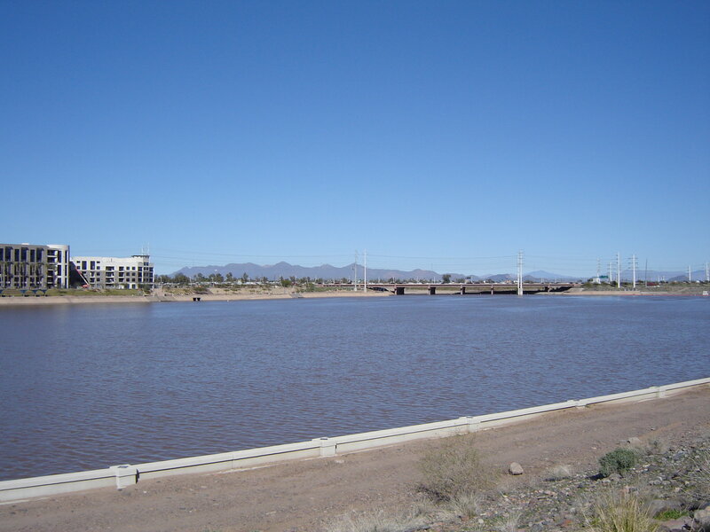 River with Bridge and Buildings — Blue