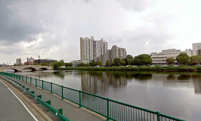 River with Bridge and Buildings — Gray