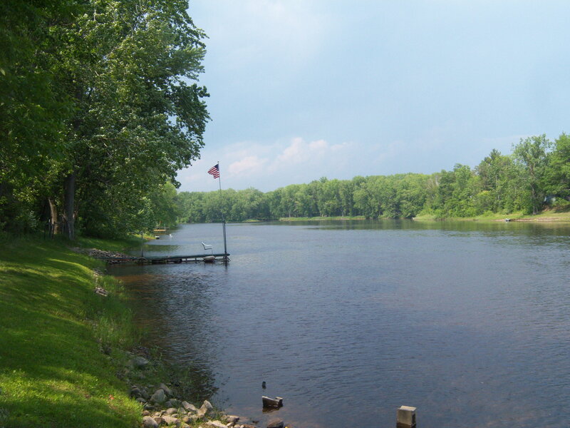 River with dock and American flag