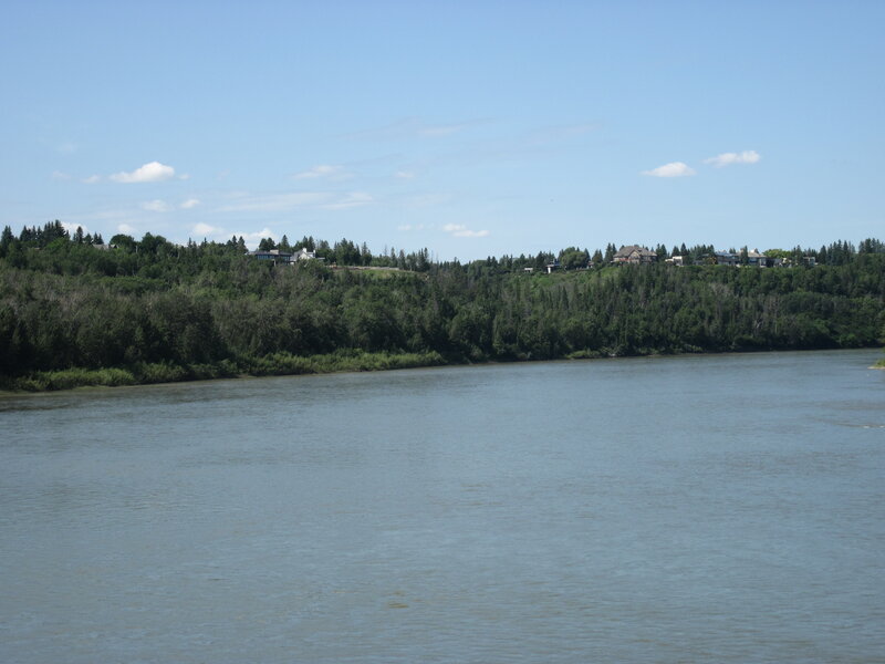 River with Forested Bank — Blue