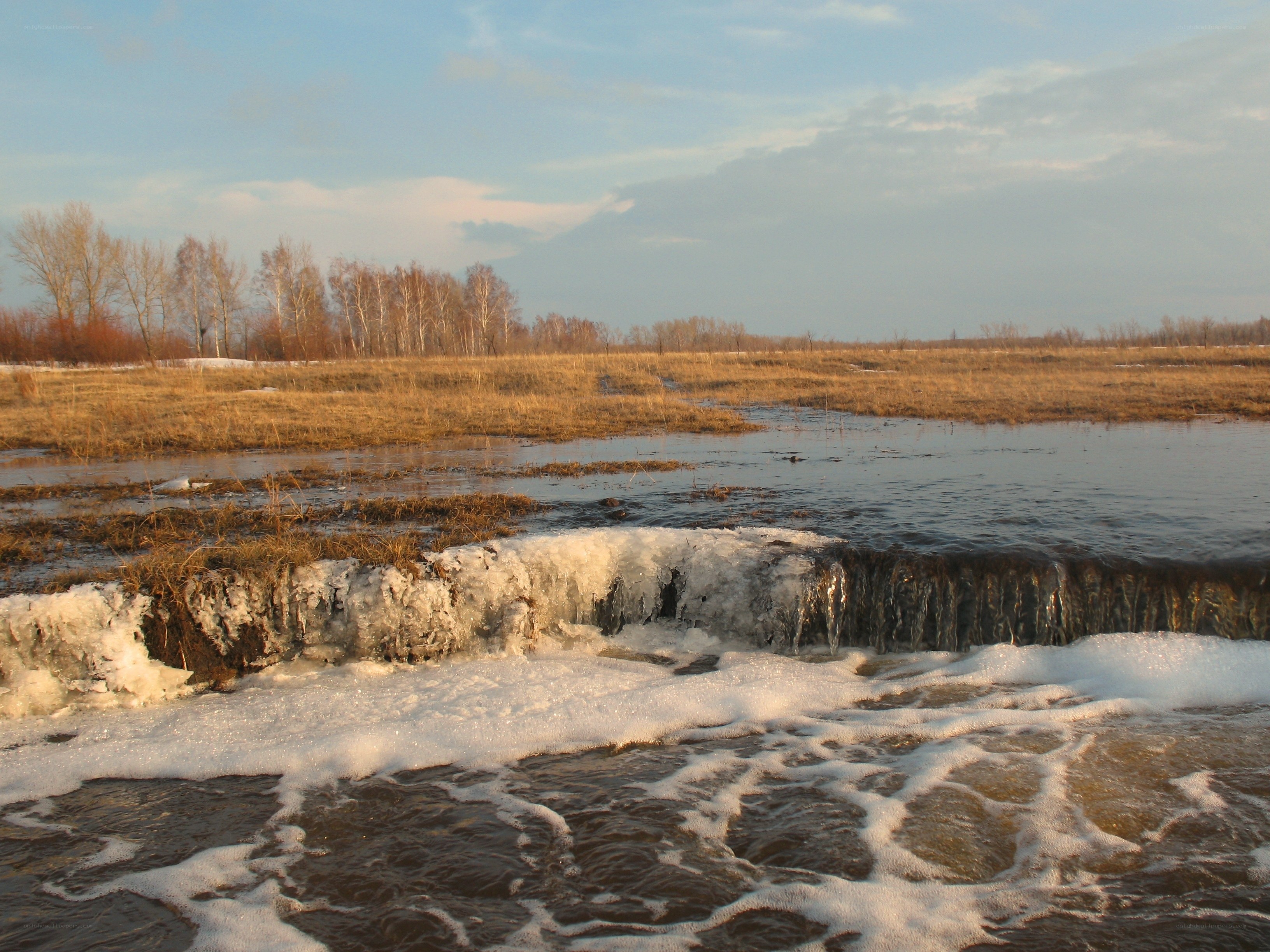 River with ice and foam