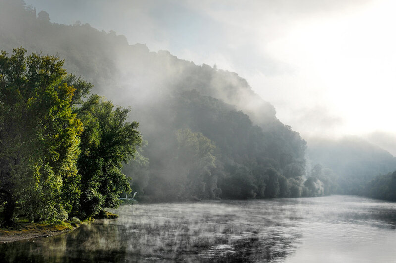 River with Misty Hills