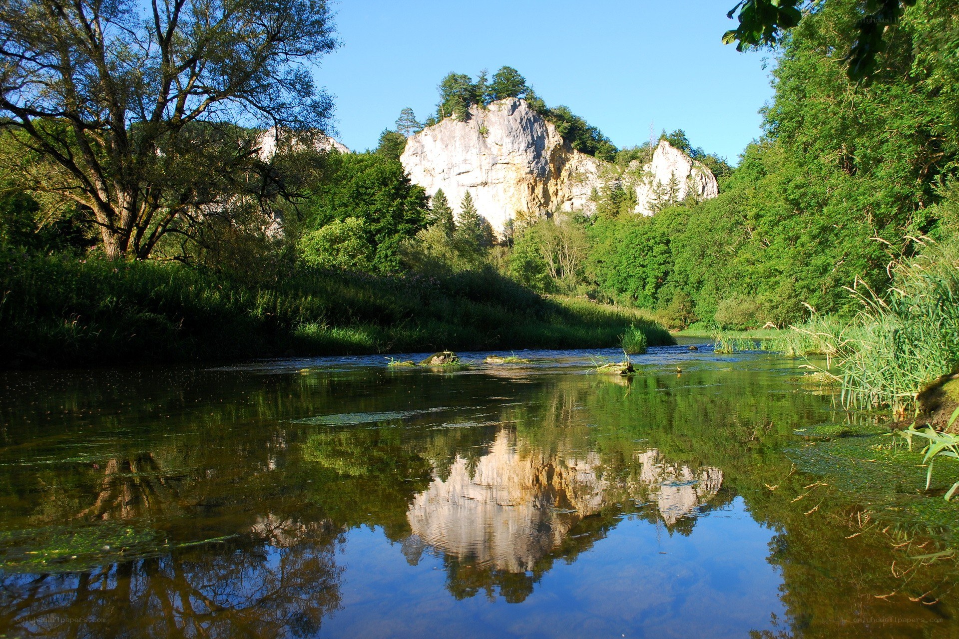 River with rock formation reflection