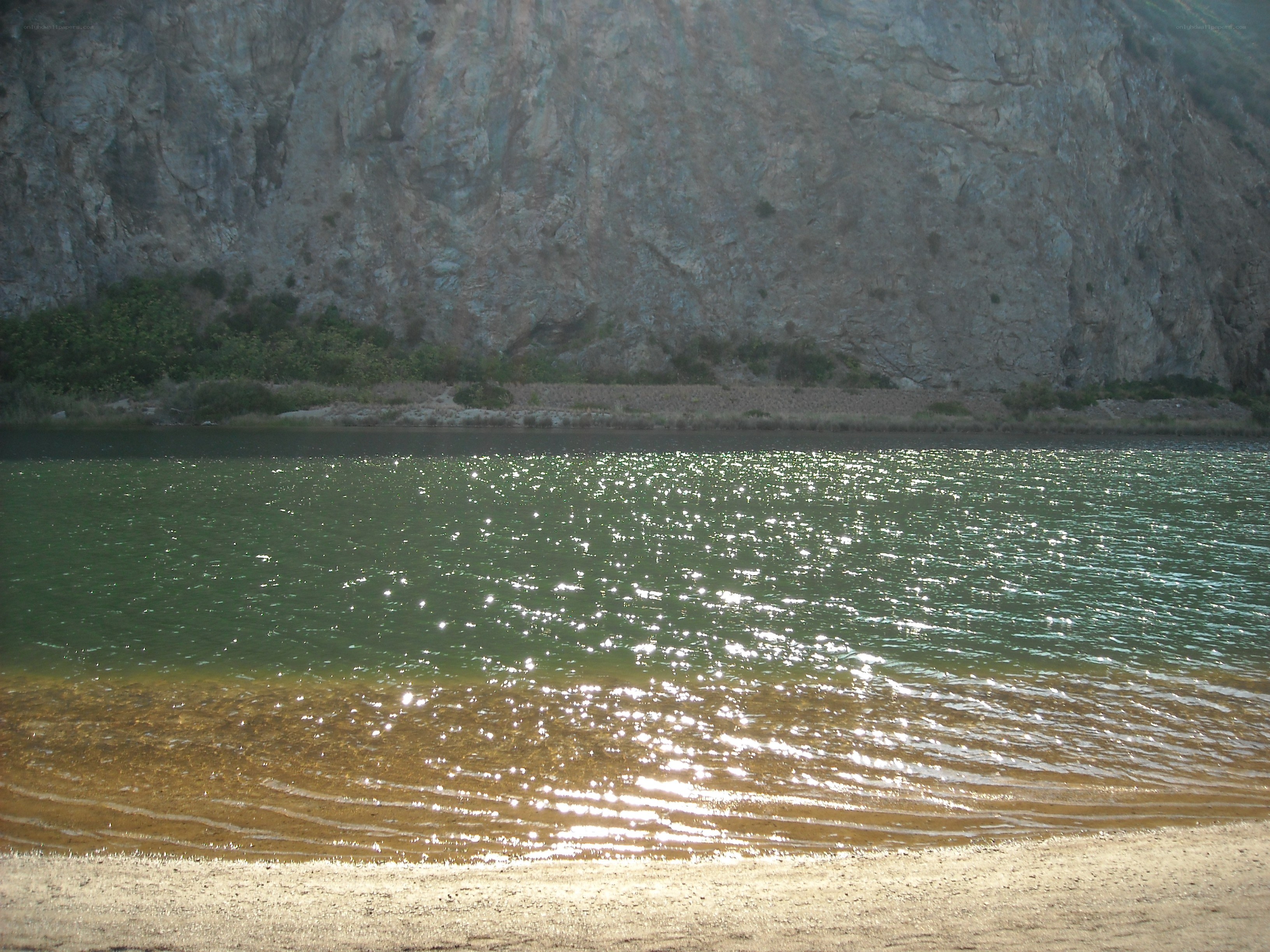 River with rocky cliff