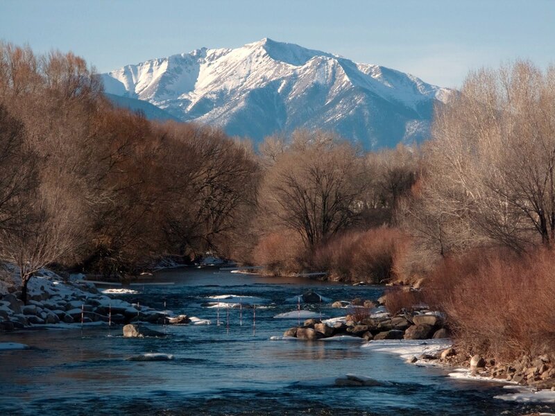 river with snow-capped mountains