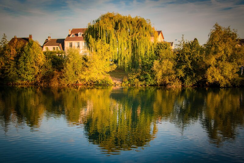 Riverbank with Houses — Blue