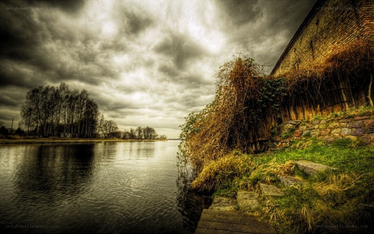 Riverbank with old brick wall