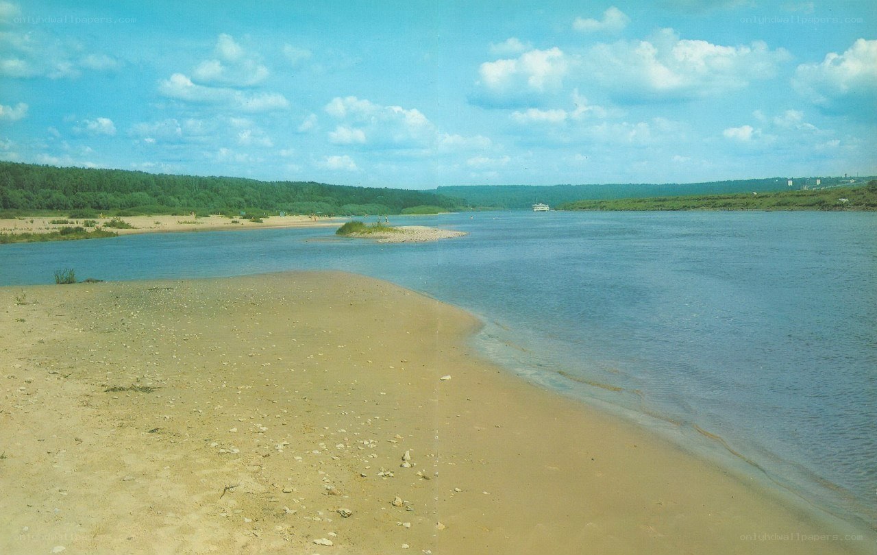Riverbank with sandbar and boat