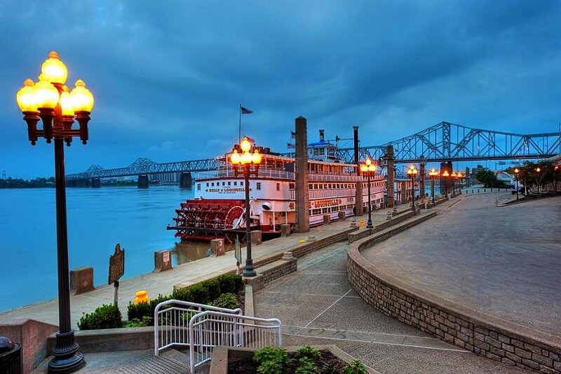 riverboat at dusk with bridge